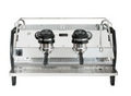 A professional espresso machine with a stainless steel body, black side panels, two portafilter holders with black handles, and a metal drip tray, shown against a plain white background.