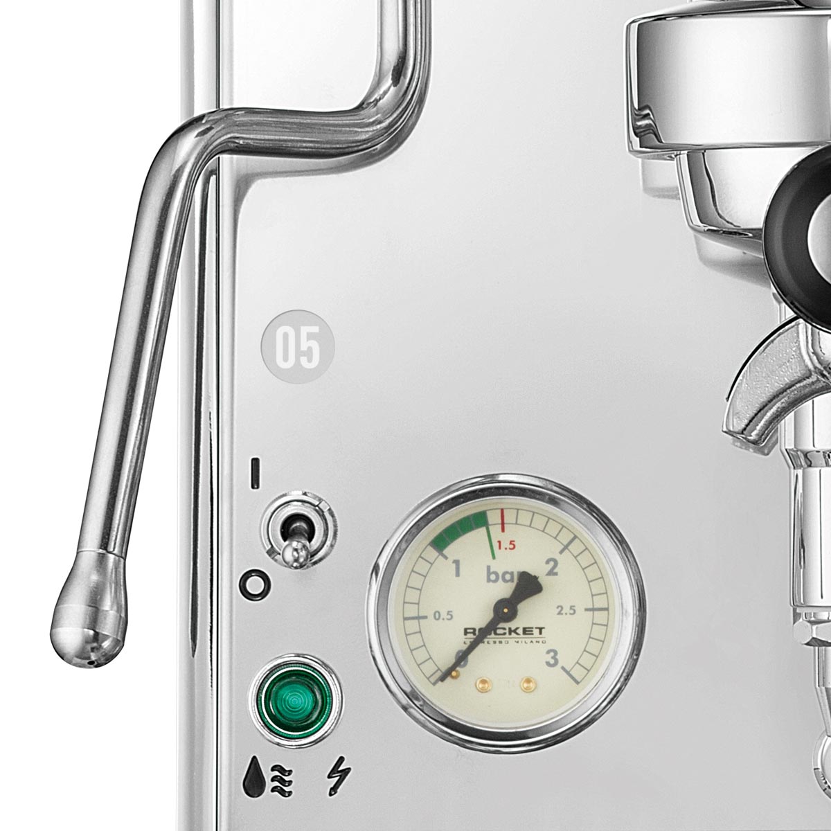 Close-up of a coffee machine with a pressure gauge and control panel.