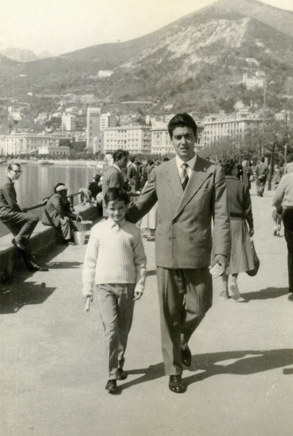 Carlo Di Ruocco walking with his son on the Salerno waterfront