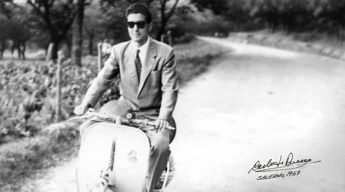 Carlo Di Ruocco riding a Vespa in Salerno, Italy, 1957