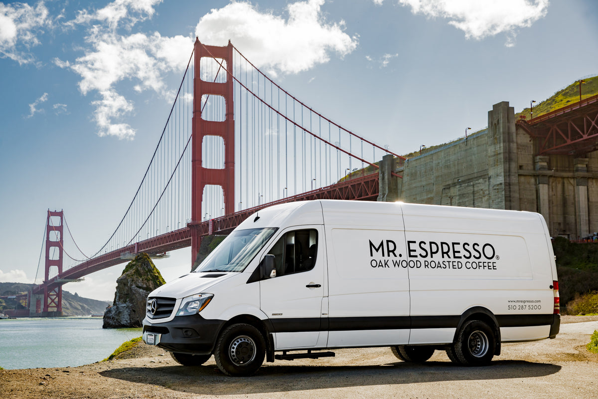 Mr. Espresso delivery van parked near the Golden Gate Bridge